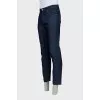 Men's dark blue jeans with embroidery on the pockets