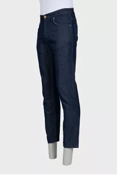 Men's dark blue jeans with embroidery on the pockets