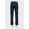 Men's dark blue jeans with embroidery on the pockets