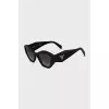 Sunglasses with a shaped black frame