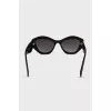 Sunglasses with a shaped black frame
