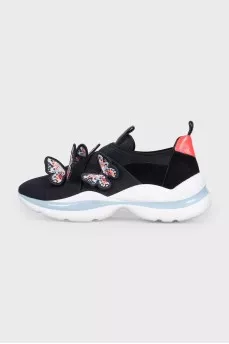 Black sneakers decorated with butterflies
