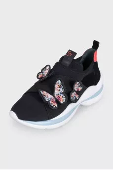 Black sneakers decorated with butterflies