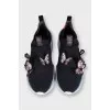 Black sneakers decorated with butterflies