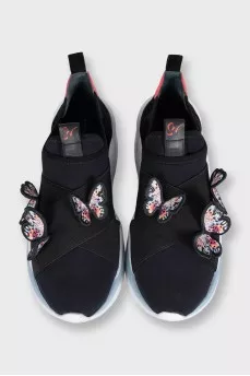 Black sneakers decorated with butterflies