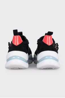 Black sneakers decorated with butterflies