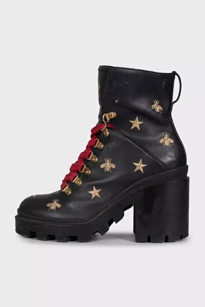 Leather ankle boots with gold embroidery