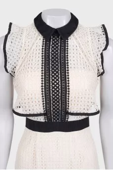 Beige dress decorated with perforations