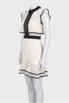 Beige dress decorated with perforations