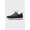 Black sneakers decorated with rhinestones