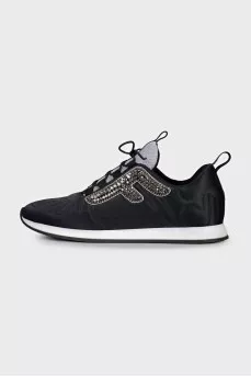 Black sneakers decorated with rhinestones