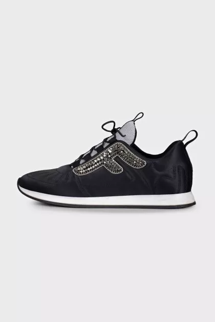Black sneakers decorated with rhinestones