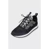 Black sneakers decorated with rhinestones