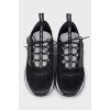Black sneakers decorated with rhinestones