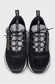Black sneakers decorated with rhinestones