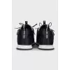 Black sneakers decorated with rhinestones