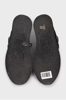 Black sneakers decorated with rhinestones