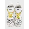 Men's white high-top sneakers with a print