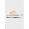 Beige canvas slides with tag