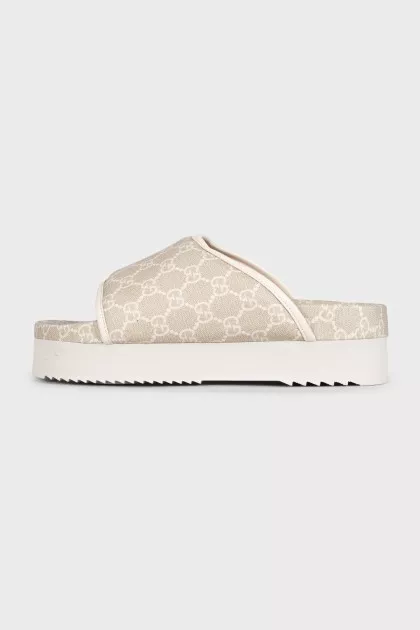 Beige canvas slides with tag