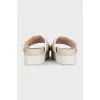 Beige canvas slides with tag