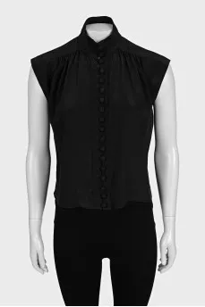 Black sleeveless blouse with voluminous buttons