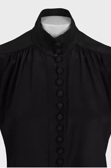 Black sleeveless blouse with voluminous buttons