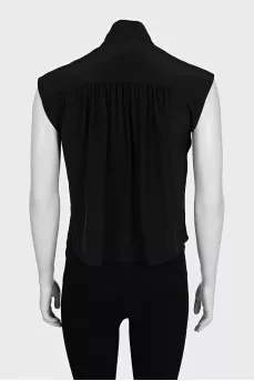 Black sleeveless blouse with voluminous buttons