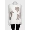 Beige short-sleeved blouse decorated with sequins
