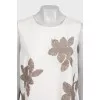 Beige short-sleeved blouse decorated with sequins