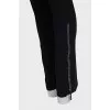 Black high-waisted trousers with rhinestones