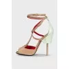 Suede sandals with leather inserts and a shaped heel