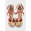 Suede sandals with leather inserts and a shaped heel