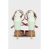 Suede sandals with leather inserts and a shaped heel