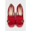 Red suede shoes with fringe