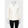 Yellow jacket with ruffles on the sleeves