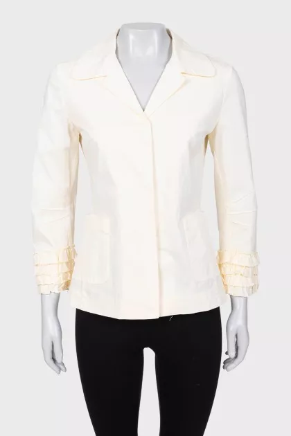 Yellow jacket with ruffles on the sleeves