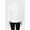 Yellow jacket with ruffles on the sleeves