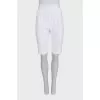 White high-waist shorts with a zipper
