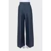 Wide-leg trousers with creases and tag