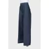 Wide-leg trousers with creases and tag