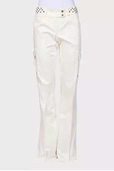 Flared trousers decorated with eyelets