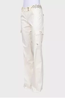 Flared trousers decorated with eyelets