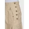 Button-down mini skirt with tag