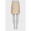 Button-down mini skirt with tag
