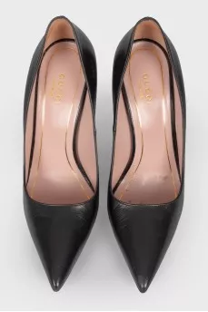 Black leather stilettos with a sharp toe