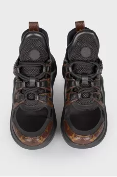 Black-brown leather sneakers with a bend on the sole