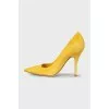 Yellow suede pumps