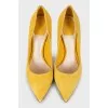 Yellow suede pumps