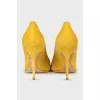 Yellow suede pumps